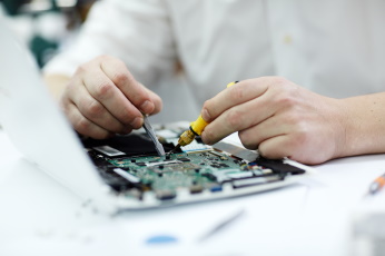 male-hands-repairing-laptop